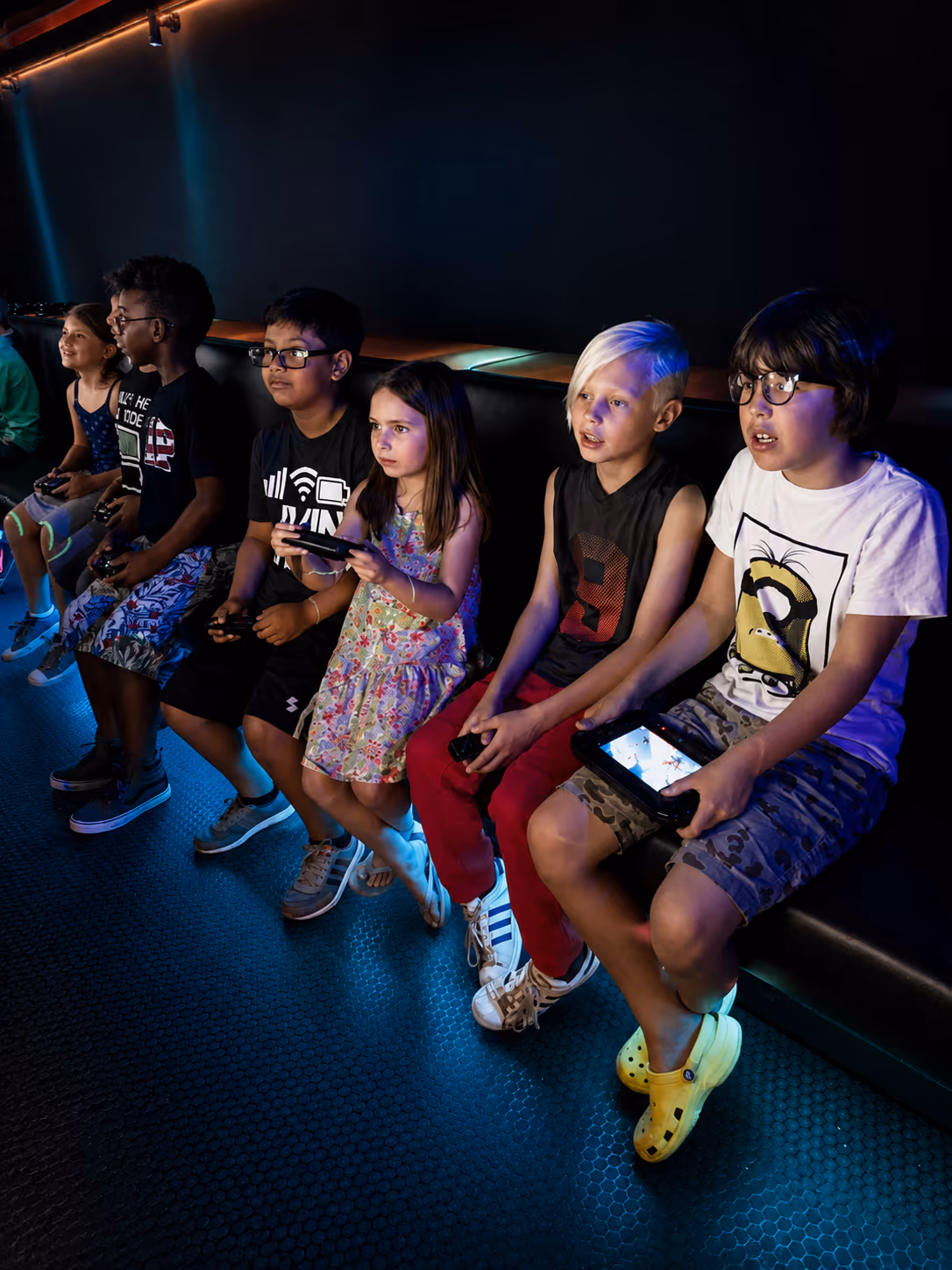 Kids playing video games inside the Miami game truck